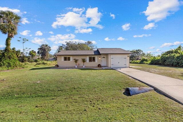 ranch-style house featuring a garage and a front lawn