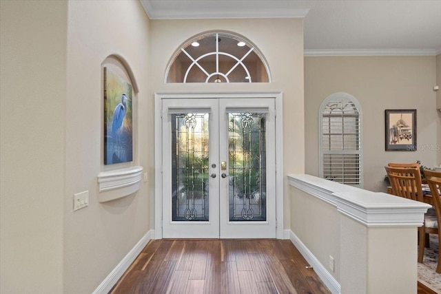 doorway to outside with dark hardwood / wood-style floors, ornamental molding, and french doors