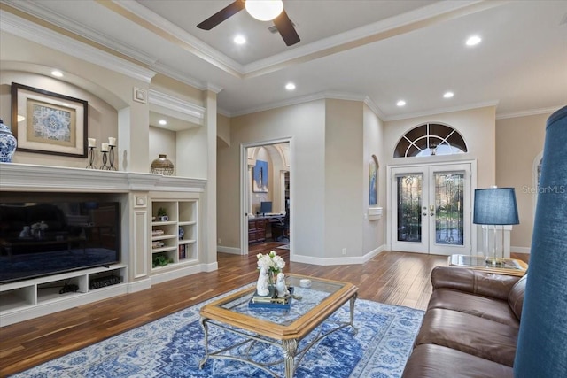 living room featuring french doors, crown molding, and hardwood / wood-style floors