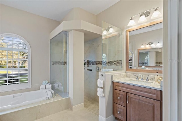 bathroom with vanity, tile patterned floors, and independent shower and bath