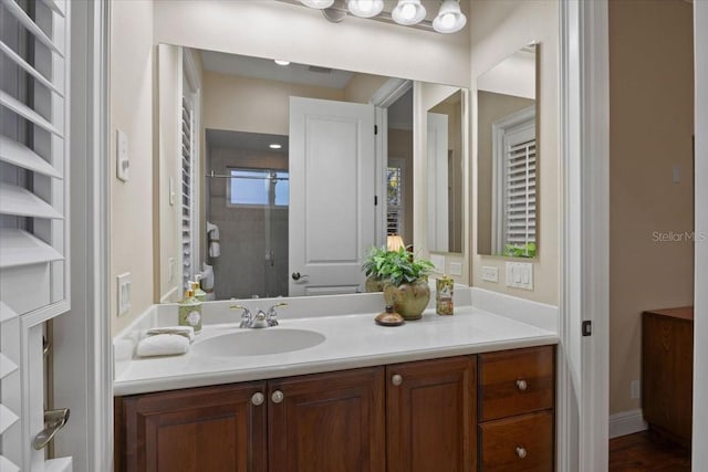 bathroom with hardwood / wood-style floors and vanity