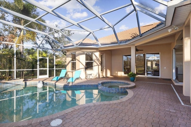 view of swimming pool featuring a lanai, an in ground hot tub, and a patio