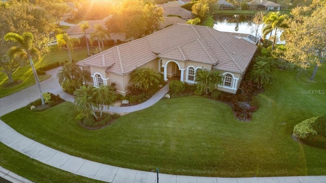 birds eye view of property featuring a water view