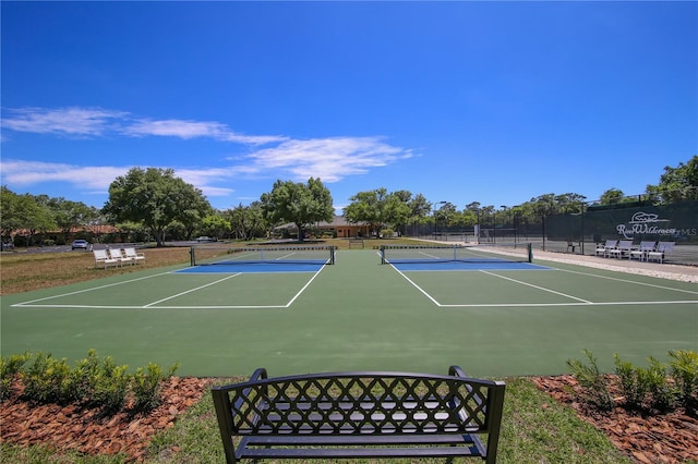 view of tennis court featuring basketball court