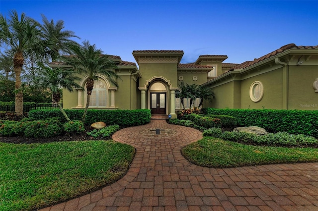 mediterranean / spanish home with french doors