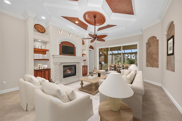 living room with ceiling fan, coffered ceiling, built in features, crown molding, and a fireplace