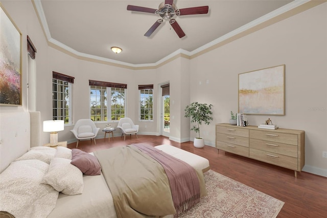 bedroom with ceiling fan, dark hardwood / wood-style floors, and ornamental molding