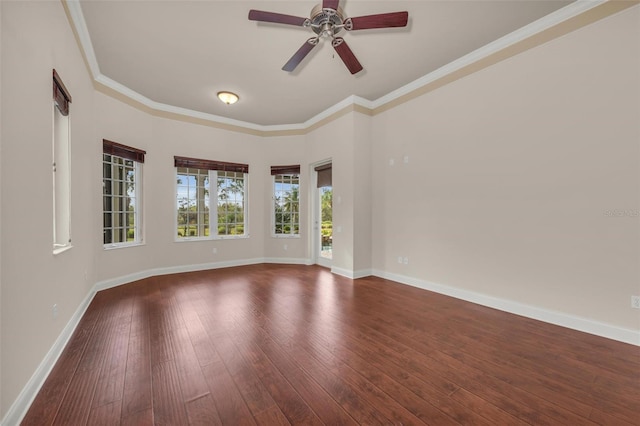 unfurnished room featuring ceiling fan, dark hardwood / wood-style flooring, and ornamental molding