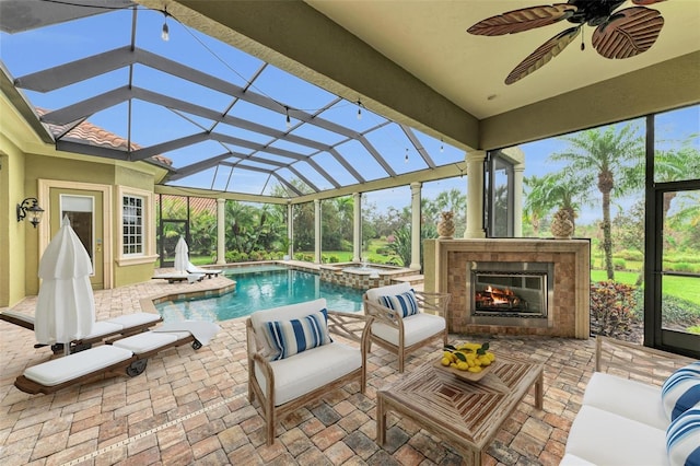 view of swimming pool featuring an outdoor living space with a fireplace, a patio, and ceiling fan