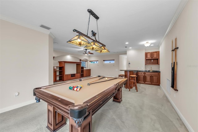 rec room featuring crown molding, pool table, light colored carpet, and bar area