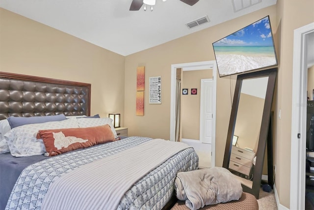 bedroom featuring carpet floors, vaulted ceiling, and ceiling fan