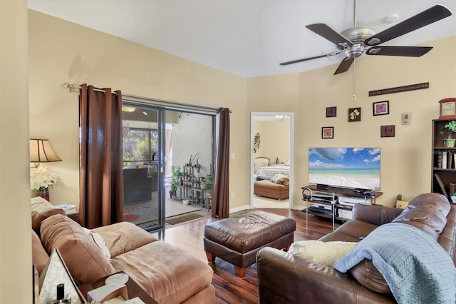 living room featuring ceiling fan and wood-type flooring