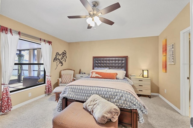 bedroom with ceiling fan and light colored carpet