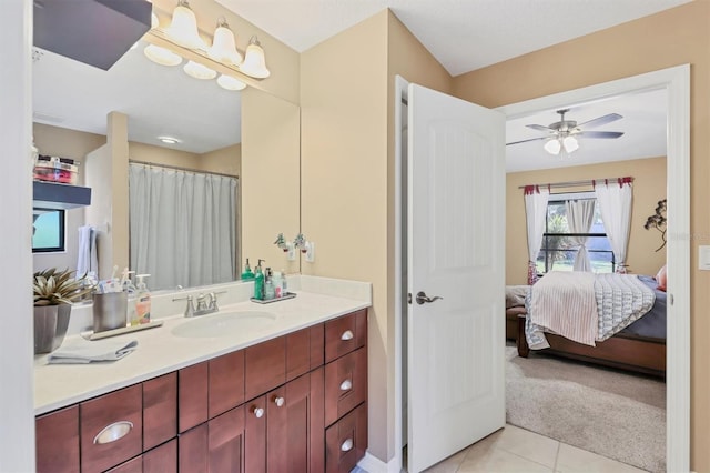 bathroom featuring ceiling fan, tile patterned flooring, and vanity