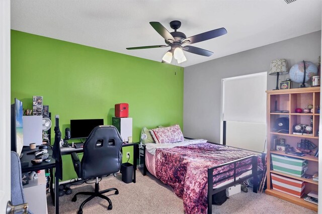 carpeted bedroom with ceiling fan