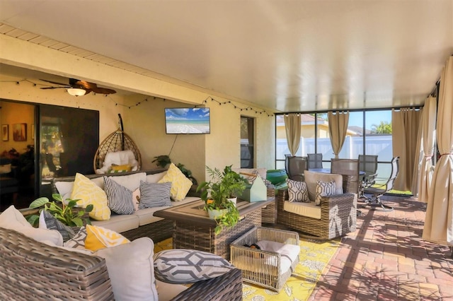 sunroom / solarium with ceiling fan