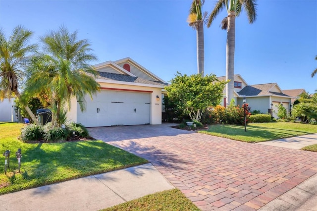 view of front facade with a garage and a front lawn