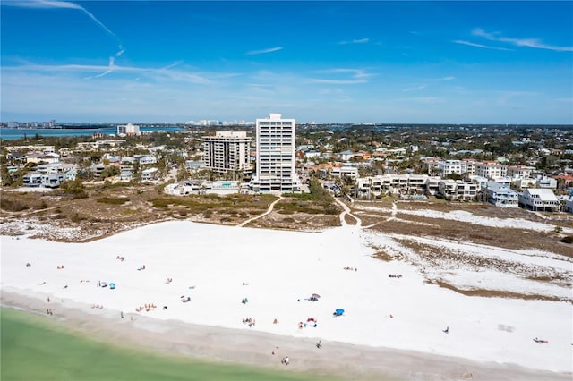 birds eye view of property with a beach view and a water view