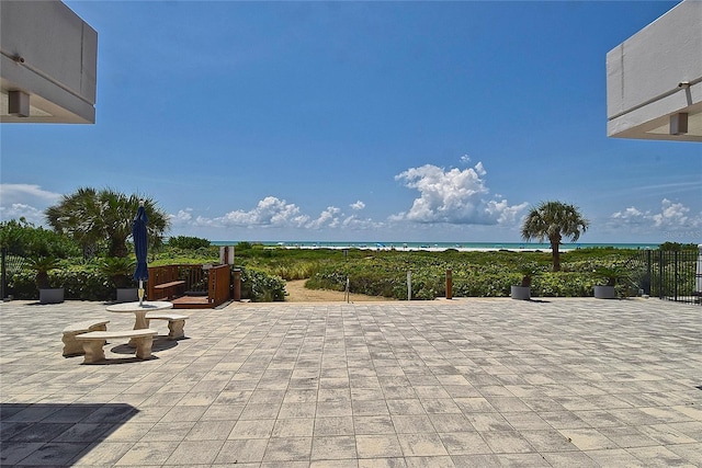 view of patio featuring a water view