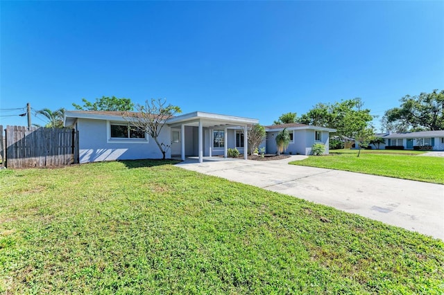 ranch-style house with a front lawn and a carport