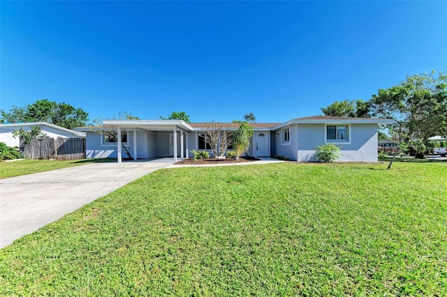 single story home featuring a front yard and a carport