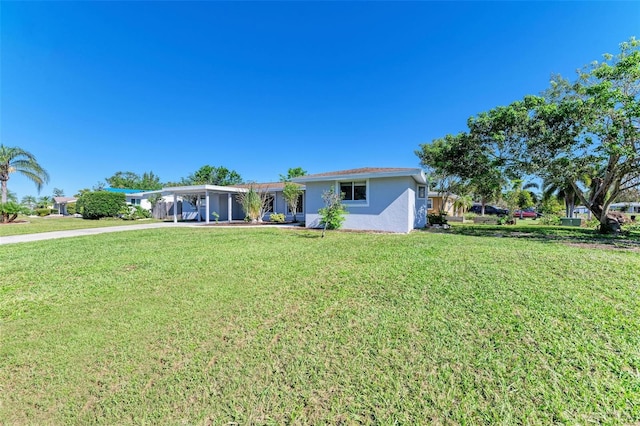 single story home featuring a front yard and a carport