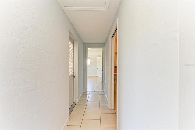 hall featuring light tile patterned floors