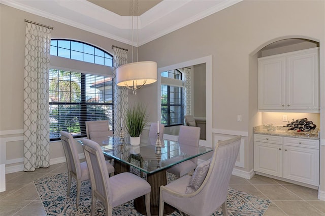 tiled dining area with crown molding