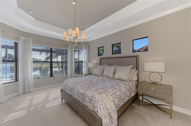 bedroom featuring a raised ceiling, a chandelier, light colored carpet, and ornamental molding