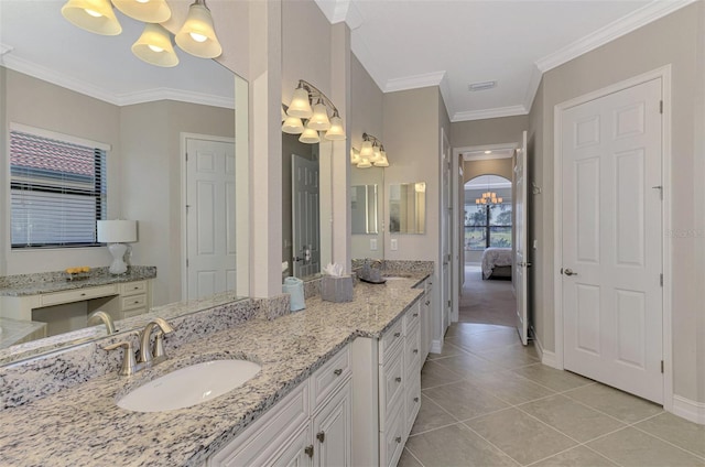 bathroom with crown molding, tile patterned flooring, vanity, and a notable chandelier