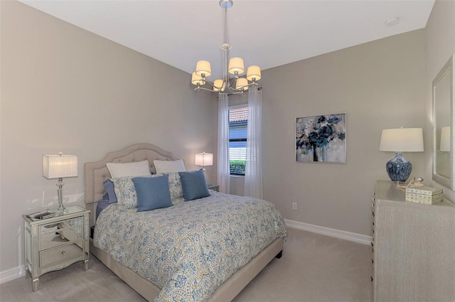 bedroom with light colored carpet and an inviting chandelier