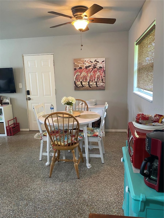 dining room with ceiling fan