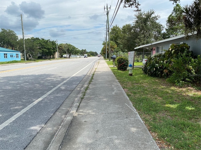 1680 17th St, Sarasota, FL 34234 - view of asphalt road featuring sidewalks and curbs