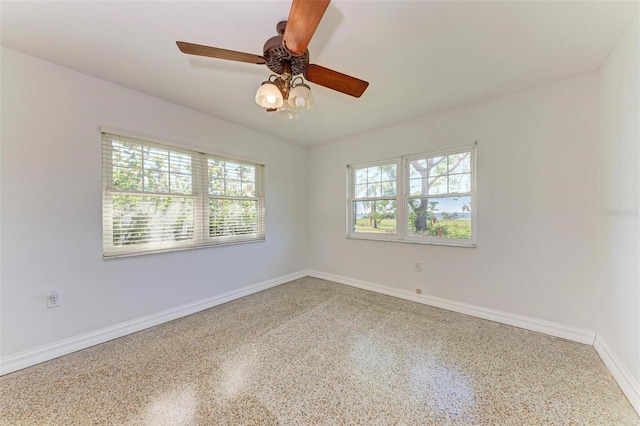 spare room with ceiling fan