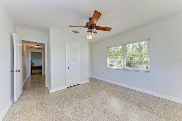 unfurnished bedroom with a closet and ceiling fan