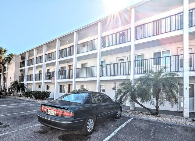 view of property featuring uncovered parking