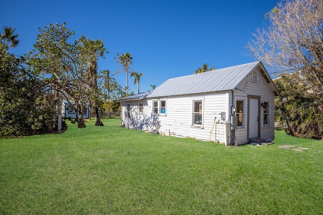 4420 119th St W, Cortez, FL 34215 - exterior space featuring an outdoor structure and a yard
