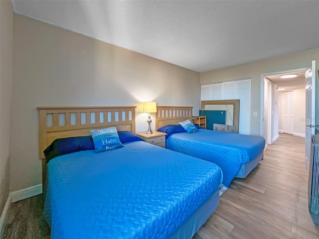 bedroom featuring hardwood / wood-style flooring