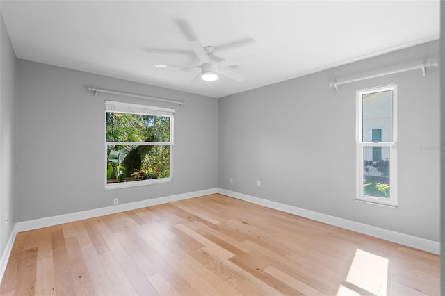 unfurnished room featuring light hardwood / wood-style flooring and ceiling fan