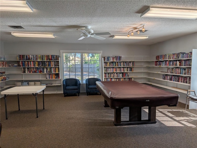 game room with ceiling fan, carpet floors, a textured ceiling, and pool table