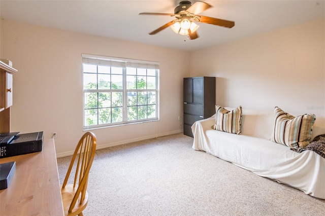 carpeted bedroom featuring ceiling fan and baseboards