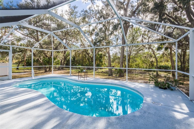 pool with a patio and a lanai