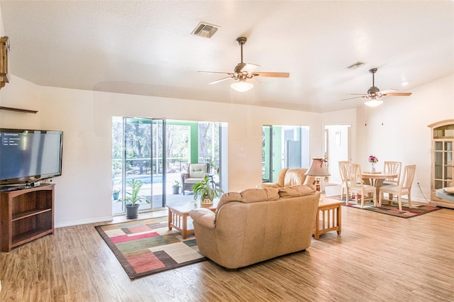 1496 Palm View Rd, Sarasota, FL 34240 - living room with light wood finished floors and ceiling fan