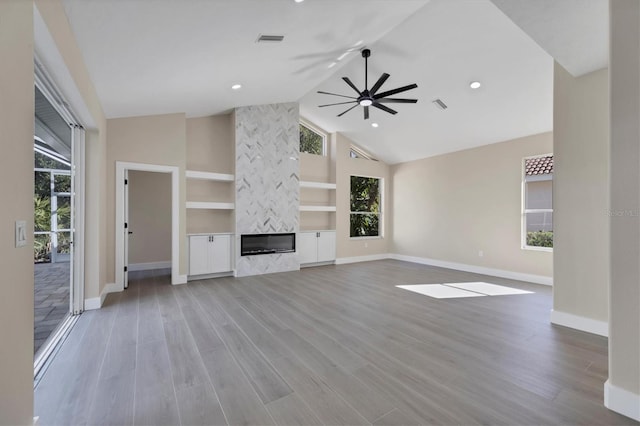 unfurnished living room featuring light hardwood / wood-style flooring and a healthy amount of sunlight