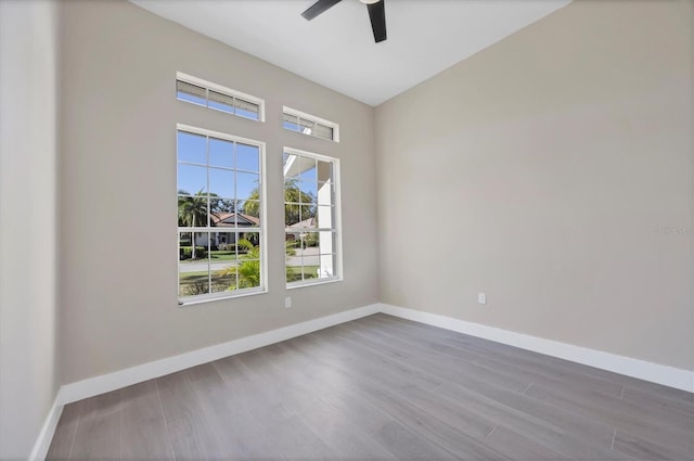 spare room featuring hardwood / wood-style flooring and ceiling fan