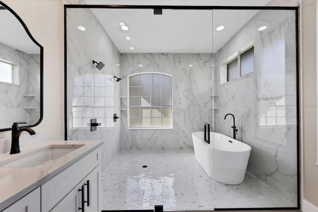 bathroom with vanity, tile walls, and independent shower and bath