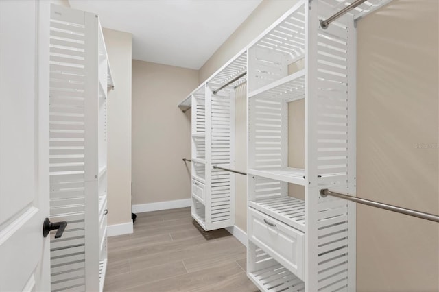 walk in closet featuring light hardwood / wood-style floors