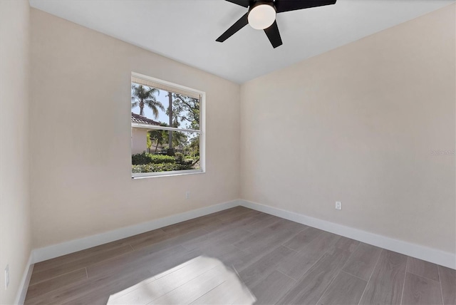 empty room featuring ceiling fan and light wood-type flooring