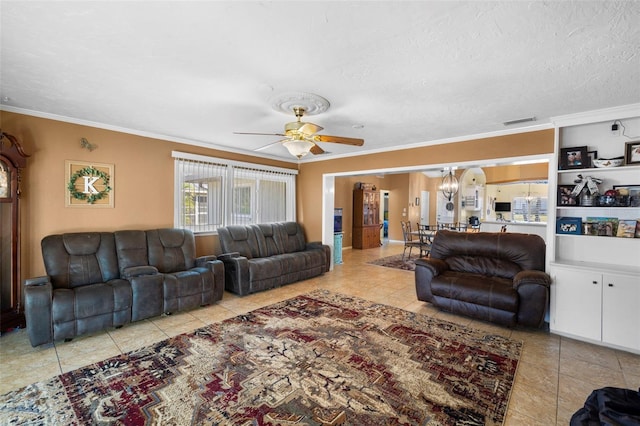 living room featuring a textured ceiling, light tile patterned floors, ceiling fan with notable chandelier, and ornamental molding