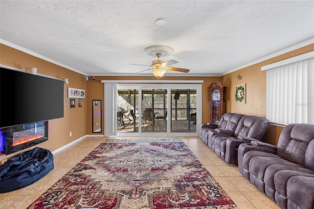 tiled living room with ceiling fan, a textured ceiling, and ornamental molding